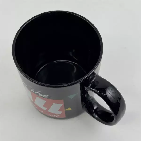 Russ Berrie & Co Inc "Over The Hill And On A Roll" Black Ceramic Mug 3.75" Tall