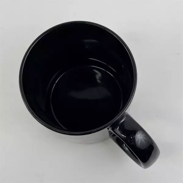 Russ Berrie & Co Inc "Over The Hill And On A Roll" Black Ceramic Mug 3.75" Tall