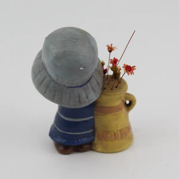 Vintage Victorian Girl With a Pitcher Of Flowers Ceramic Figurine 