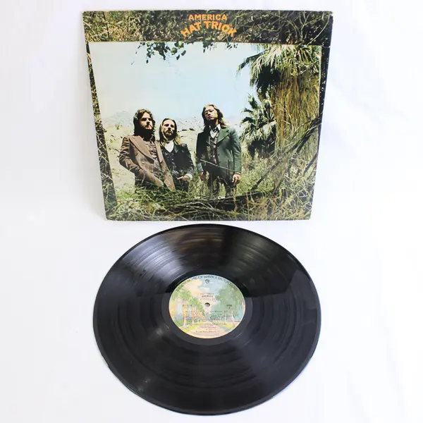 America - Hat Trick Vinyl LP (Used, Scratched) Sold As Is