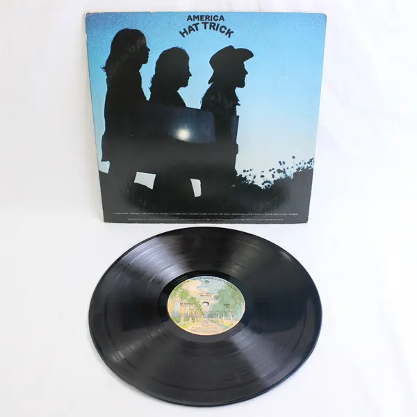 America - Hat Trick Vinyl LP (Used, Scratched) Sold As Is