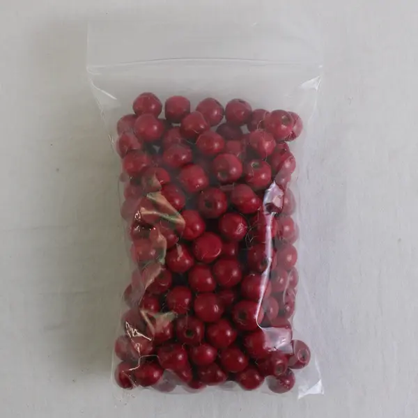 Bag of Cranberry-Red Wooden Round Beads, Circa. 50 