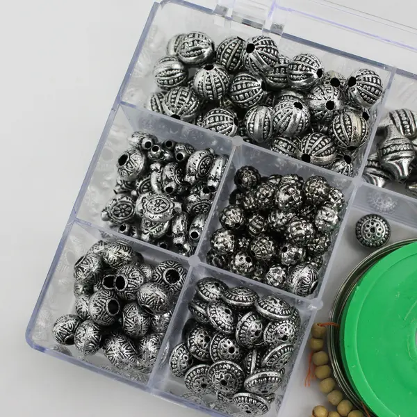 Plastic Storage Box of Assorted Metallic Beads and Thread for Jewelry-Making