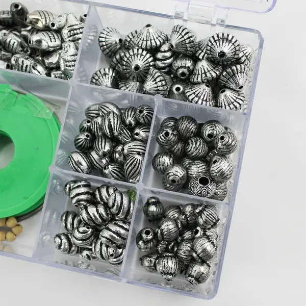 Plastic Storage Box of Assorted Metallic Beads and Thread for Jewelry-Making