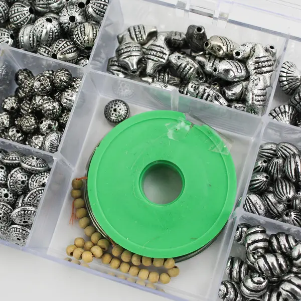 Plastic Storage Box of Assorted Metallic Beads and Thread for Jewelry-Making