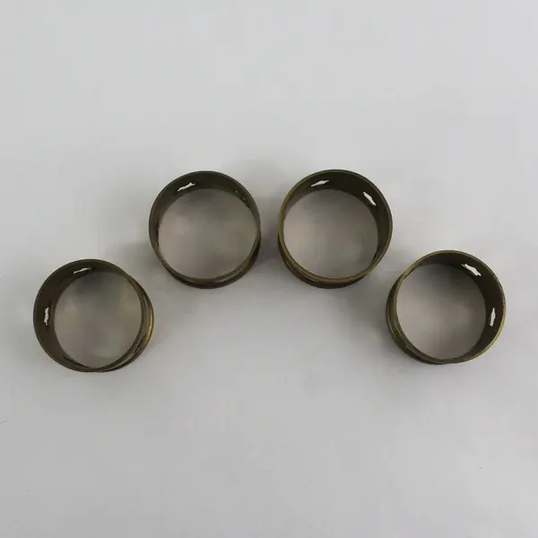 Set of 4 Brass Napkin Rings With Pierced Stars 1.75 Inch Diameter