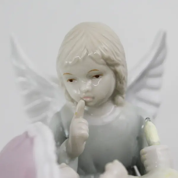 2000 Roman Inc. Ceramic Angel With A Lighted Candle With A Baby In A Bassinet