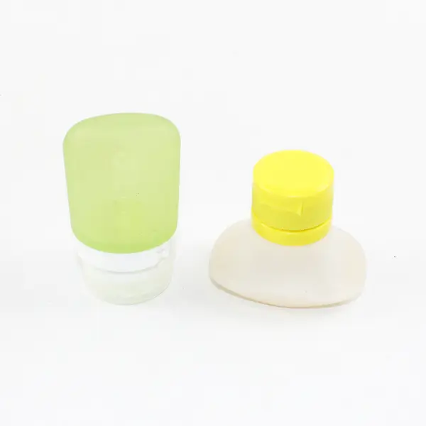 Lot of 2 Silicone Travel Bottles Reusable for Toiletries & Condiments