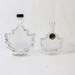 Lot of 2 Vintage Canadian Maple Leaf Glass Syrup Bottles Embossed Leaf