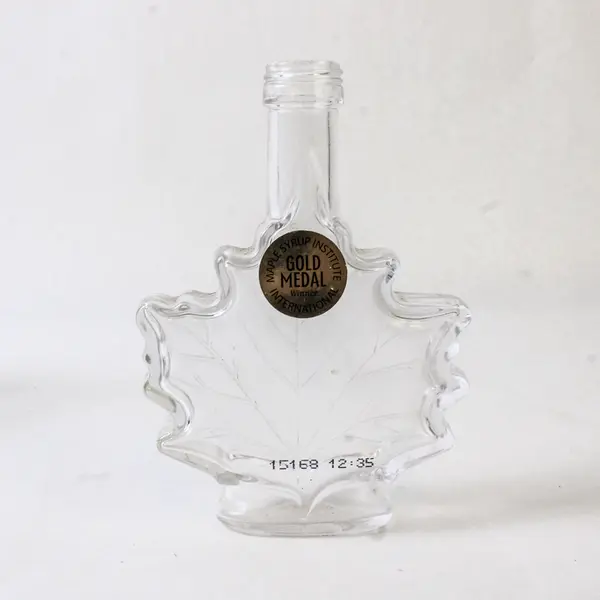 Lot of 2 Vintage Canadian Maple Leaf Glass Syrup Bottles Embossed Leaf
