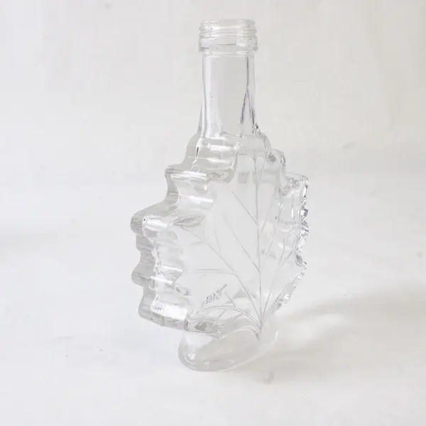 Lot of 2 Vintage Canadian Maple Leaf Glass Syrup Bottles Embossed Leaf