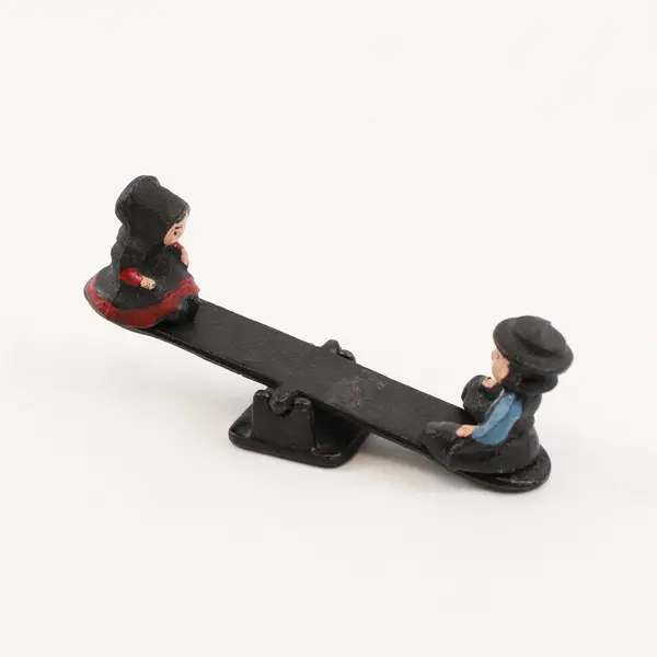 Vintage Cast Iron Amish Figurines Boy and Girl on Seesaw