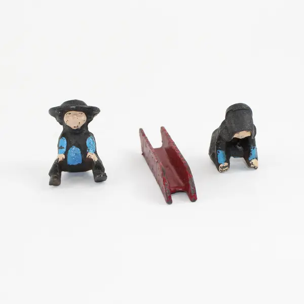 Vintage Cast Iron Amish Girl and Boy on Sled Figure