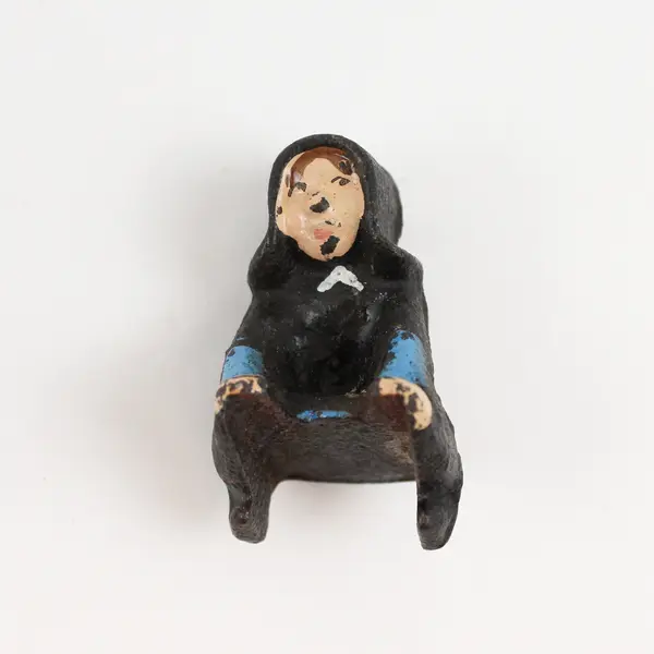 Vintage Cast Iron Amish Girl and Boy on Sled Figure