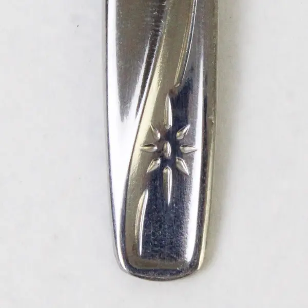 Set of 9 W.M.  Rogers & Son Stainless Steel Teaspoons Star Pattern