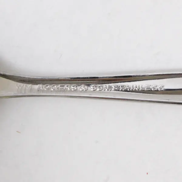 Set of 9 W.M.  Rogers & Son Stainless Steel Teaspoons Star Pattern
