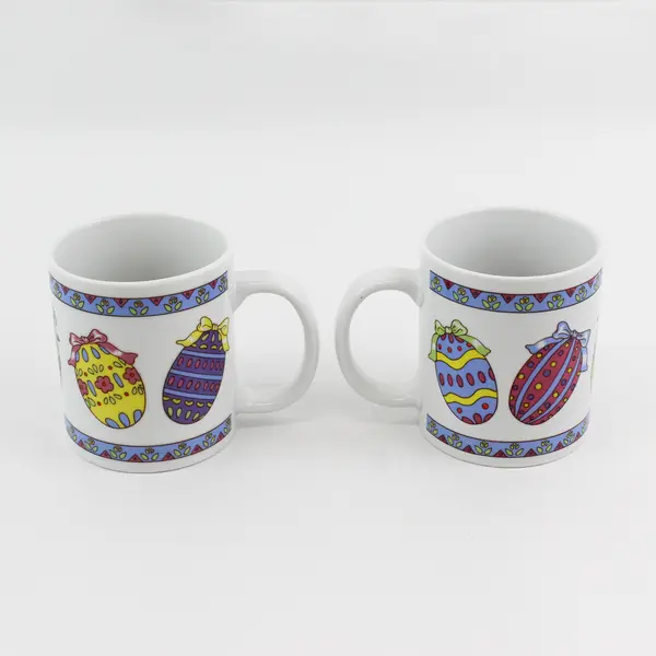 Lot of 2 Easter Themed Ceramic Mugs Featuring Colorful Decorated Eggs