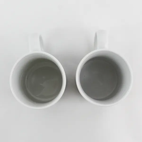 Lot of 2 Easter Themed Ceramic Mugs Featuring Colorful Decorated Eggs