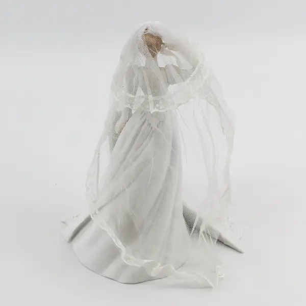 1987 Enesco Saluting Bride By G.G. Santiago
