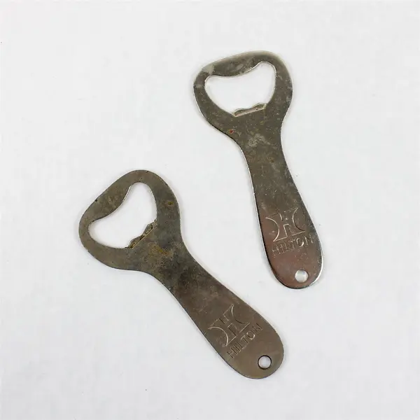 Set of 2 Vintage Hilton Hotels Metal Bottle Openers - Breweriana