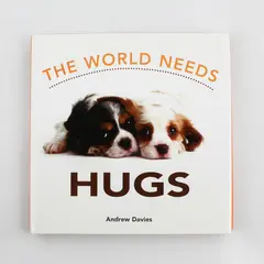 The World Needs Hugs by Andrew Davies 2004 Hardcover DJ Illustrated 1st Edition