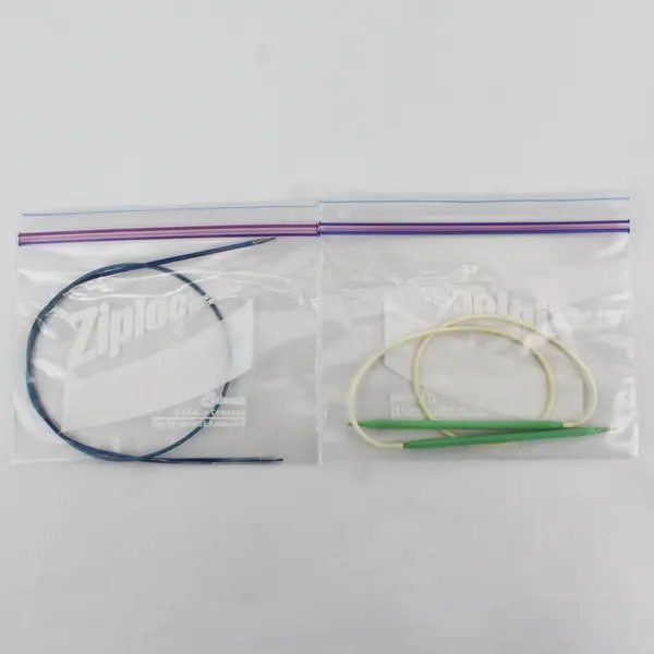 Lot of 4 Circular Knitting Needles And A Seed Stitcher