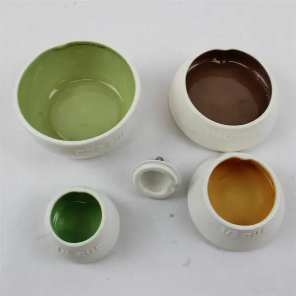 Magenta Rae Dunn Ceramic Pear Shaped 4 Piece Stacking Measuring Cup Set 