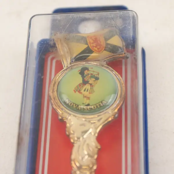 AALCO Nova Scotia Souvenir Spoon - Bagpiper & Flag Handle