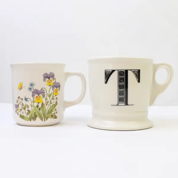 Lot of 2 Ceramic Coffee Mugs White Floral & Black 'T' Used