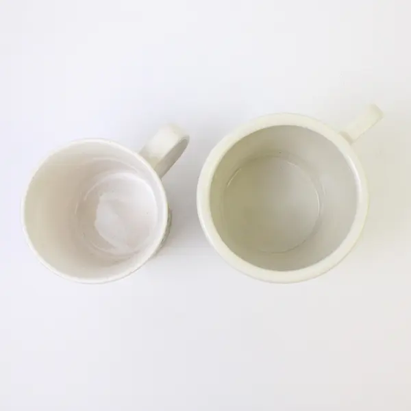 Lot of 2 Ceramic Coffee Mugs White Floral & Black 'T' Used
