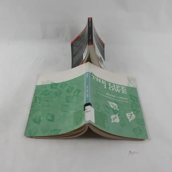 Lot of 2 Paperbacks: Basic Christianity & The Life I Owe