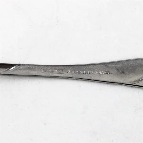 Four Stainless Swirl Sand Salad Forks by Cambridge. Made in China.