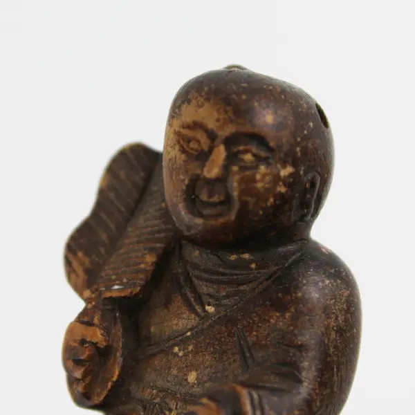 Hand Carved Wood Asian Miniature Male Holding A Feather Or Fan