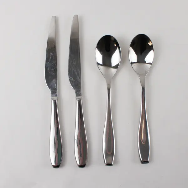 Two Stainless Tablespoons and Two Dinner Knives by Towle in the Pattern Symphony