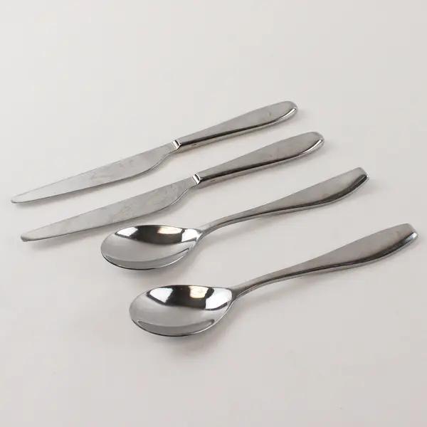Two Stainless Tablespoons and Two Dinner Knives by Towle in the Pattern Symphony