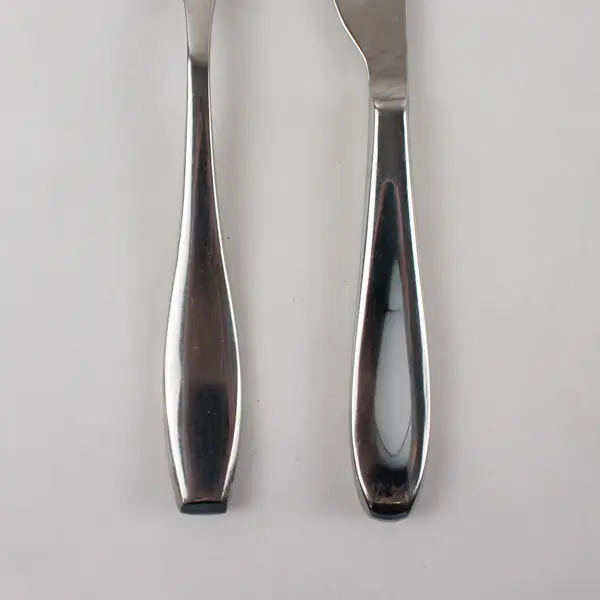 Two Stainless Tablespoons and Two Dinner Knives by Towle in the Pattern Symphony