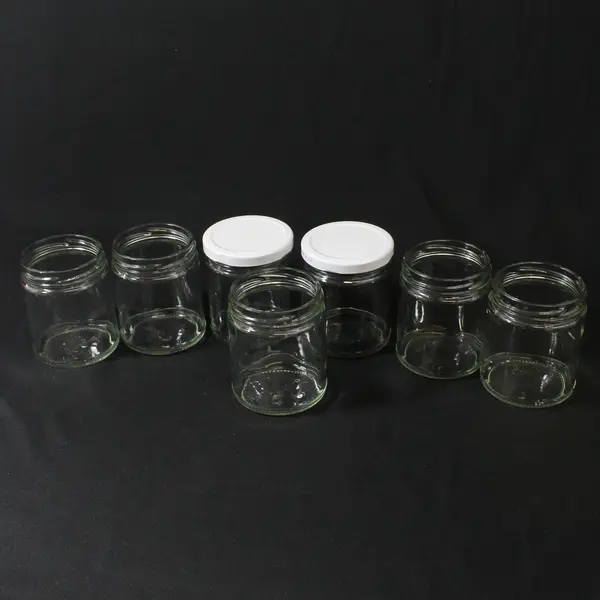 Lot of 7 Glass Jars For Jams or Jellies Approximately 1/2 Pint