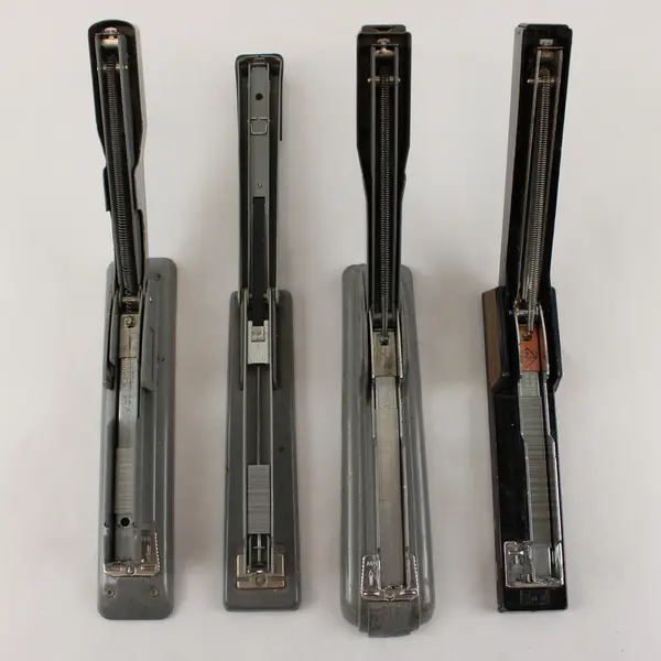 Four Vintage Swingline Staplers Gunmetal Grey (3) &  one w/ Woodgrain Pattern 