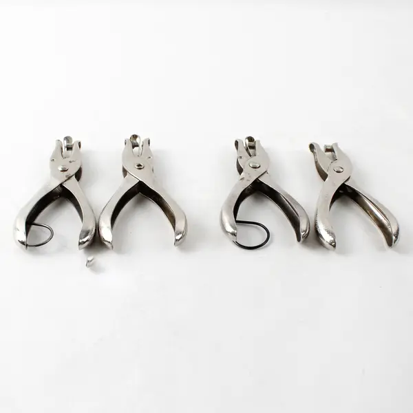 Lot of 4 McGill single hole punchers, stainless steel 