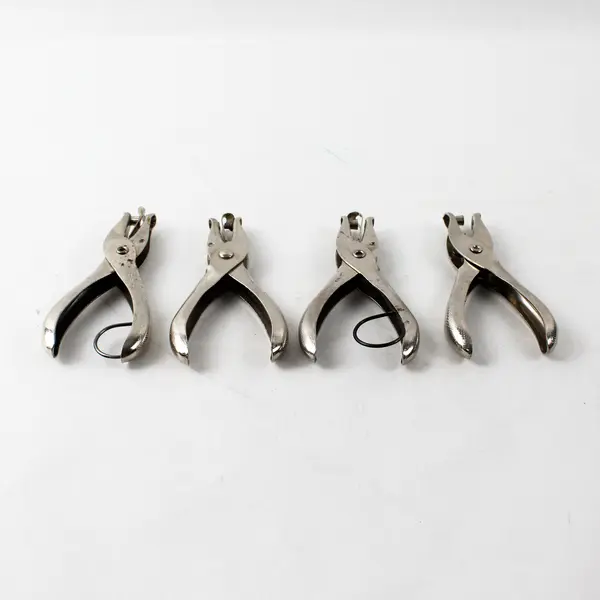 Lot of 4 McGill single hole punchers, stainless steel 