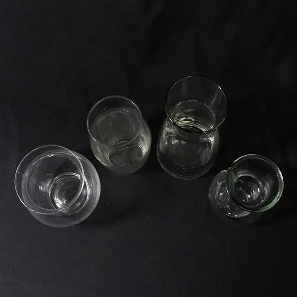 Lot of 4 Curvy Clear Glass Vases Varied Sizes 5" to 8.5"