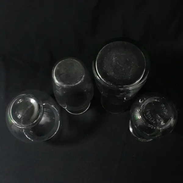 Lot of 4 Curvy Clear Glass Vases Varied Sizes 5" to 8.5"