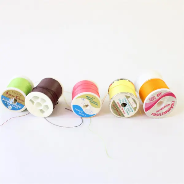 Lot of 9 Sewing Thread Spools Assorted Colors Partial Spools Pre-Owned