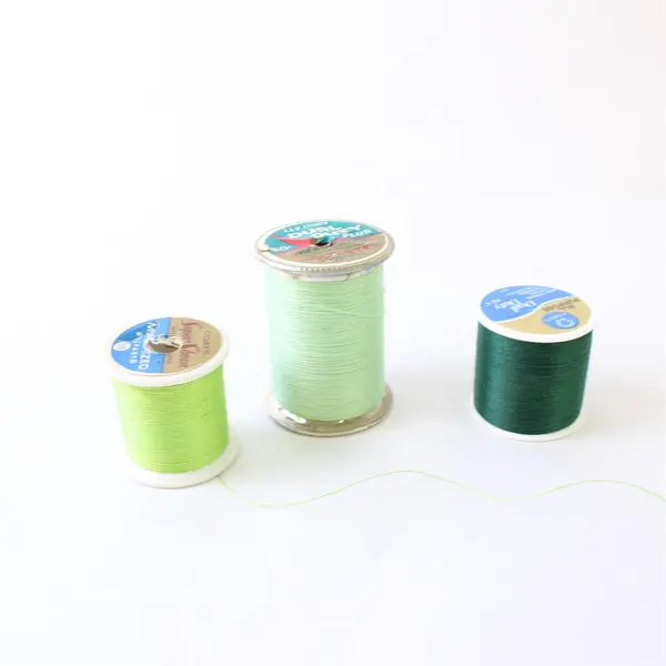 Lot of 9 Sewing Thread Spools Assorted Colors Partial Spools Pre-Owned