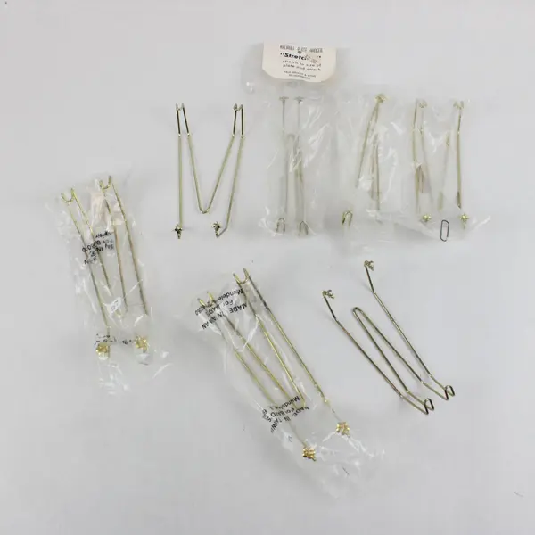 Seven Miscellaneous Plate Hangers. Brands: Bard's, Paul Briant & Sons, Unbranded