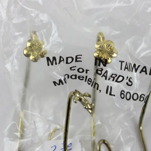 Seven Miscellaneous Plate Hangers. Brands: Bard's, Paul Briant & Sons, Unbranded