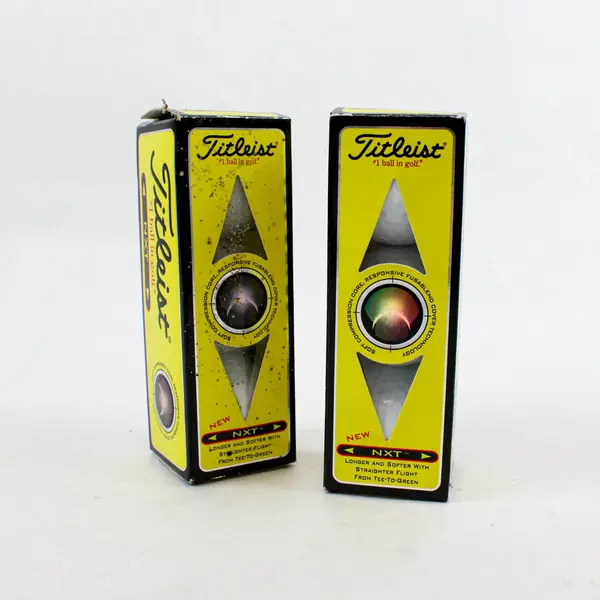 Two Open boxes of 505009 Titleist NXT Tour/Distance Golf balls - 3 per pack. 