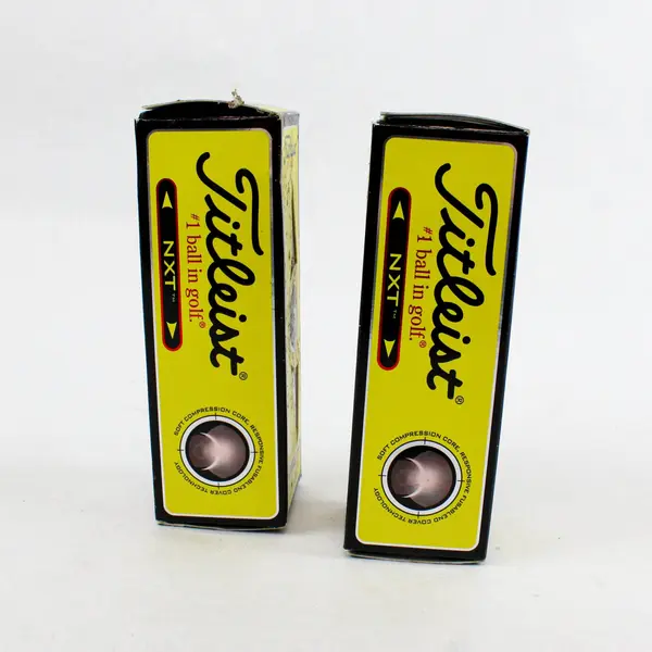 Two Open boxes of 505009 Titleist NXT Tour/Distance Golf balls - 3 per pack. 