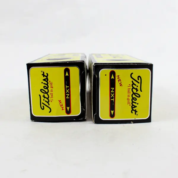 Two Open boxes of 505009 Titleist NXT Tour/Distance Golf balls - 3 per pack. 
