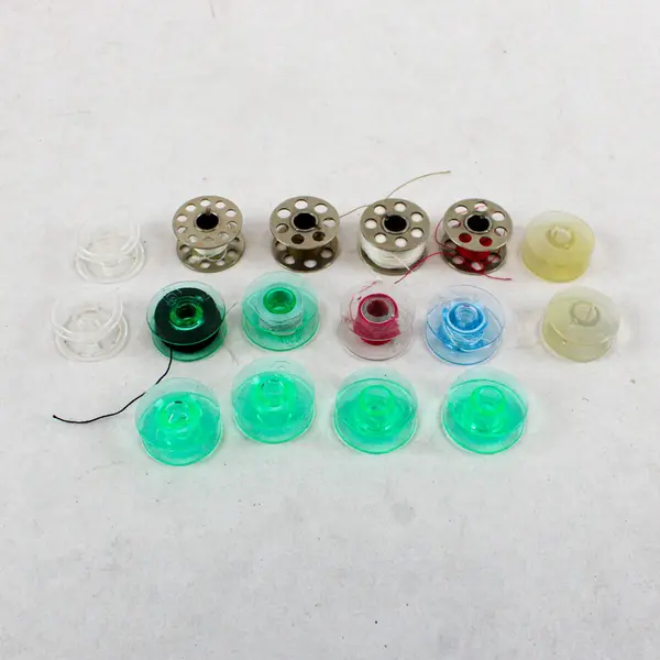Lot of 16 Assorted Sewing Machine Bobbins Husqvarna Viking Singer Kenmore